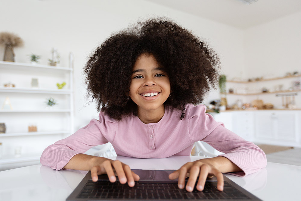 Brainline student typing on laptop